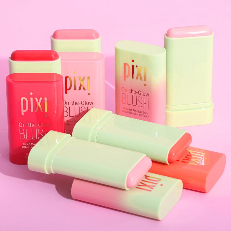 Pixi On-the-Glow Blush sticks in assorted colors against a pink background