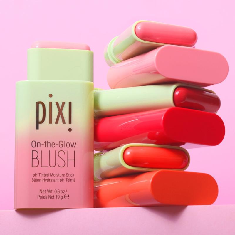 Pixi On-the-Glow Blush sticks in assorted colors against a pink background