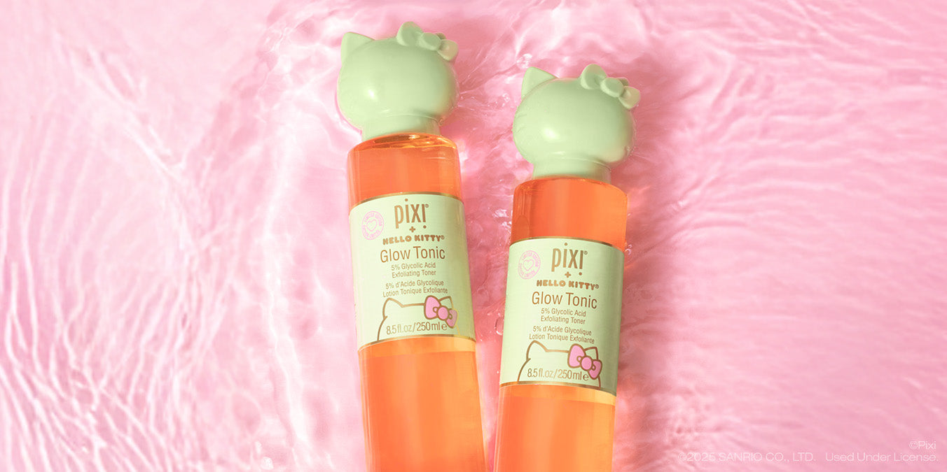Two bottles of Pixi + Hello Kitty Glow Tonic on a pink water background