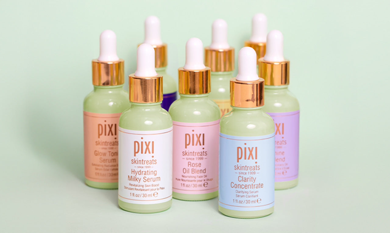 Collection of serums shown on green background - view 2