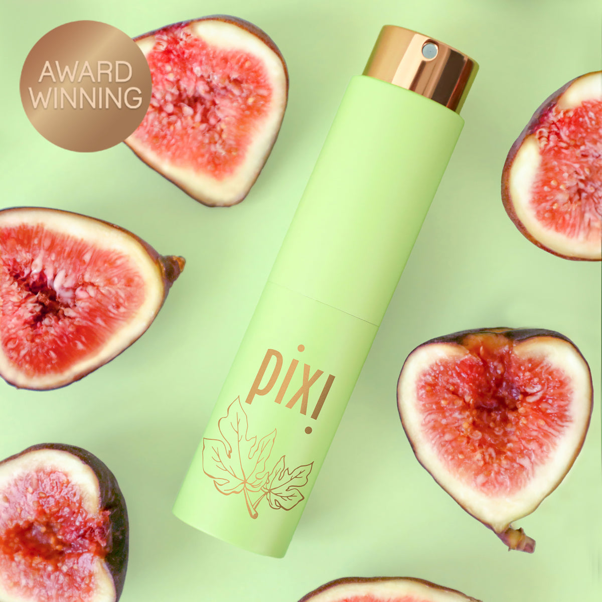 Award Winning: PixiPerfume Fig shown on a green background with figs