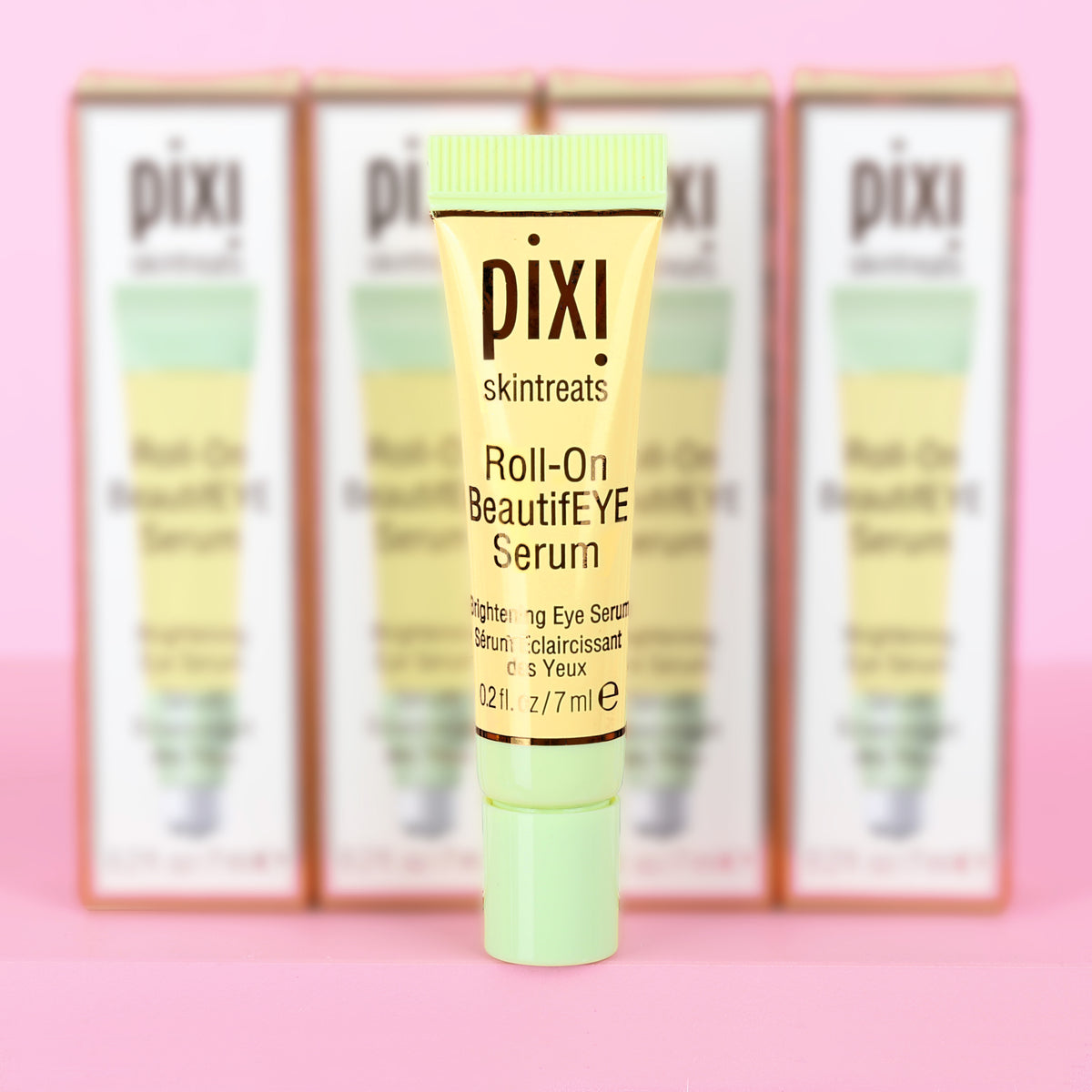 Pixi Skintreats Roll-On BeautifEYE Serum in Petite size - brightening eye serum shown with packaging in the background.