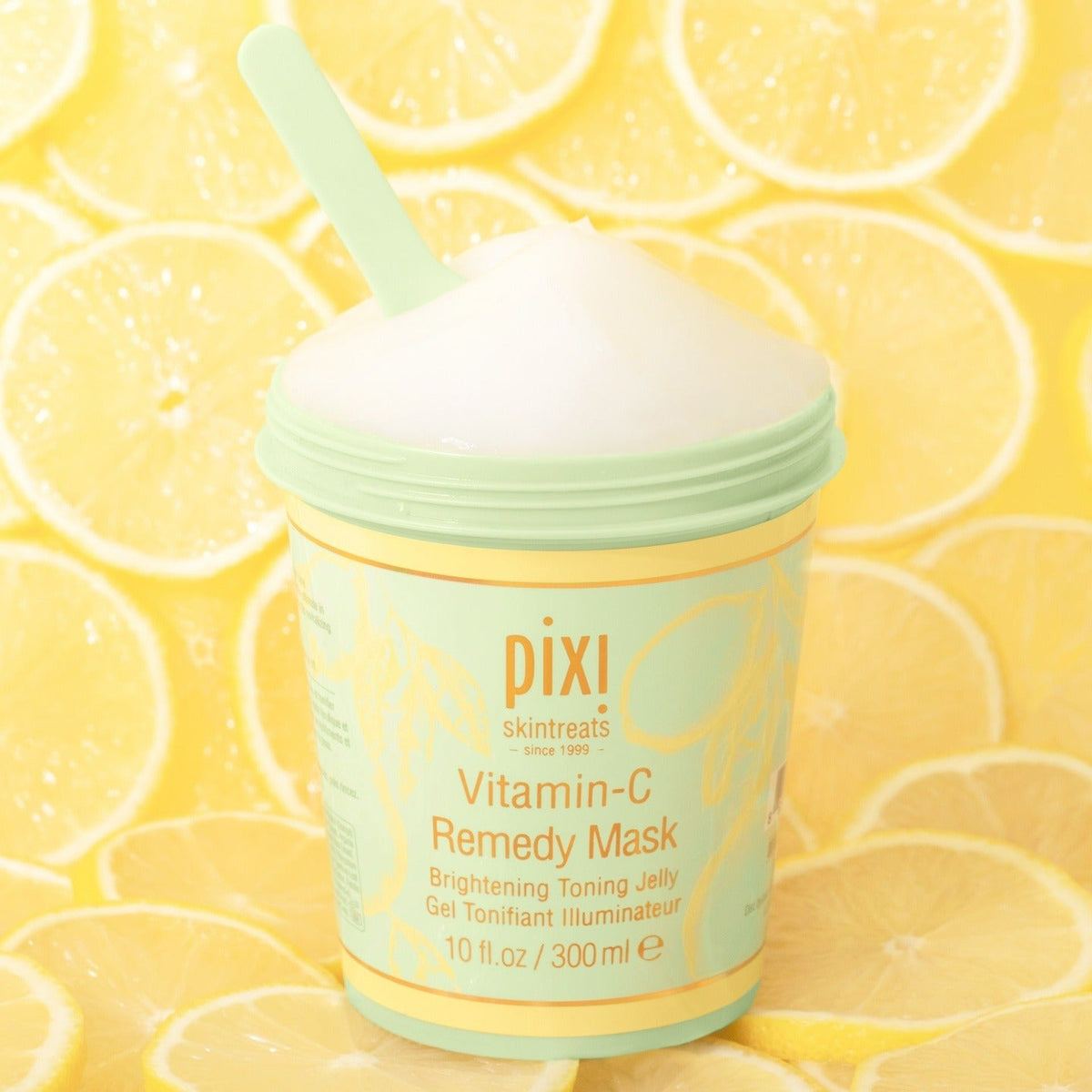 Vitamin-C Remedy Mask with lemon ingredients in the background.